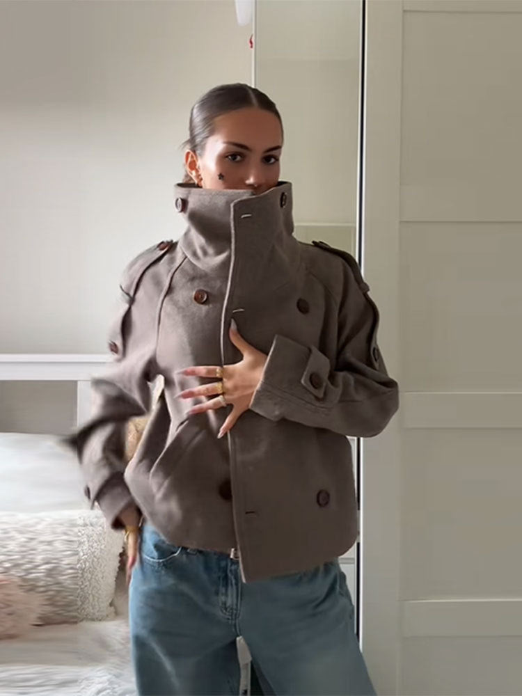 Taupe double breasted wool blend coat shown on a mannequin with the collar folded up