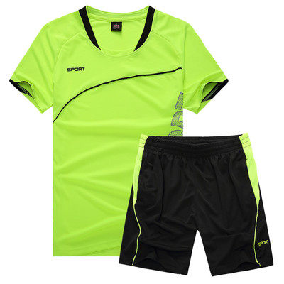 Fluorescent green jersey and black shorts laid flat on a white studio background