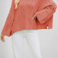Soft thick knit round neck sweater with a twist cable pattern across the front