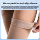 Calf length graduated compression sock in skin tone shown on the lower leg