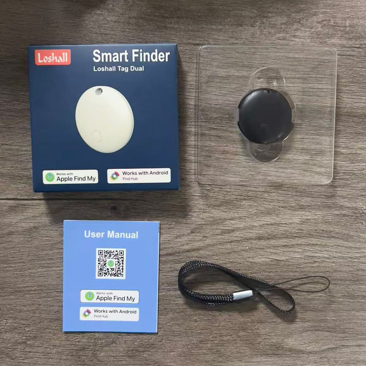 F03C Black: Loshall Tag Dual box, black round tracker in a clear tray with a lanyard and manual