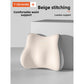 Molded ergonomic seat cushion styled on a clean neutral surface