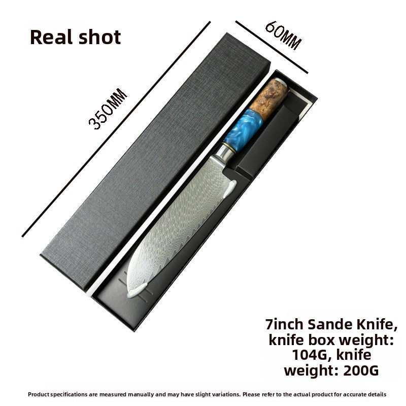 7in Damascus santoku knife with blue resin and wood handle lying in its black gift box with size markings