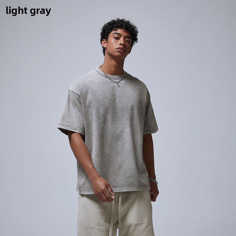 Man in a washed gray loose cotton t-shirt with dropped shoulders, variant image for size S