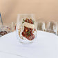 Clear borosilicate Christmas glass cup with a raised painted flat stocking holiday motif