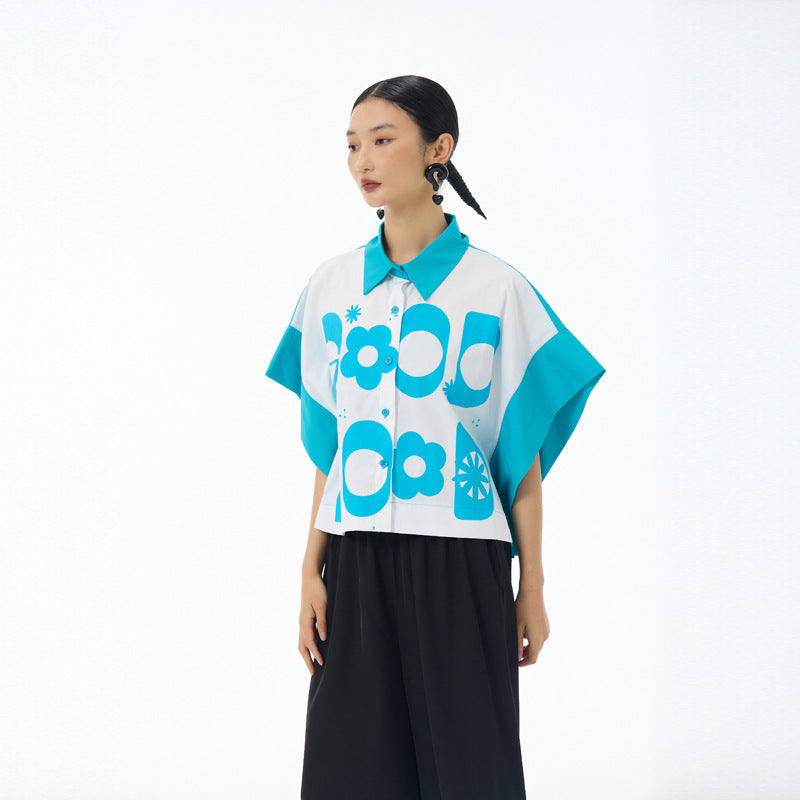 Sky blue Good Mood cropped button up shirt with batwing sleeves worn with black trousers