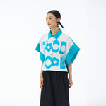 Sky blue Good Mood cropped button up shirt with batwing sleeves worn with black trousers