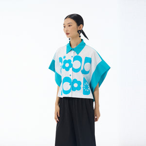 Sky blue Good Mood cropped button up shirt with batwing sleeves worn with black trousers