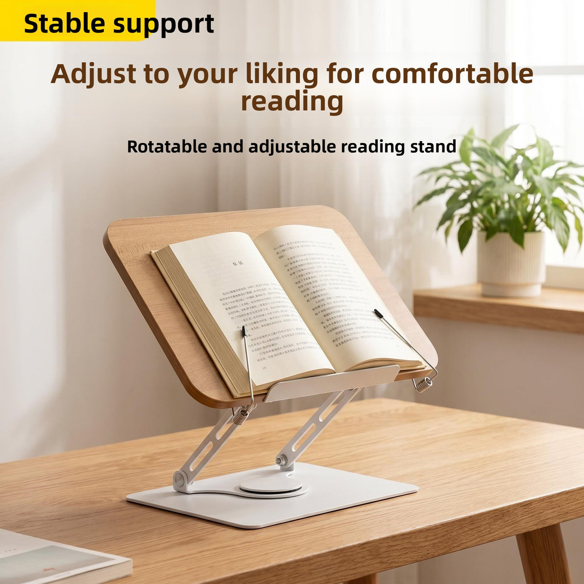 Reading stand with an open book on a wooden desk, with a plant and shelves in the background