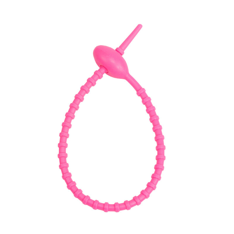 Close view of the ridged silicone strap and the tadpole head that holds the loop
