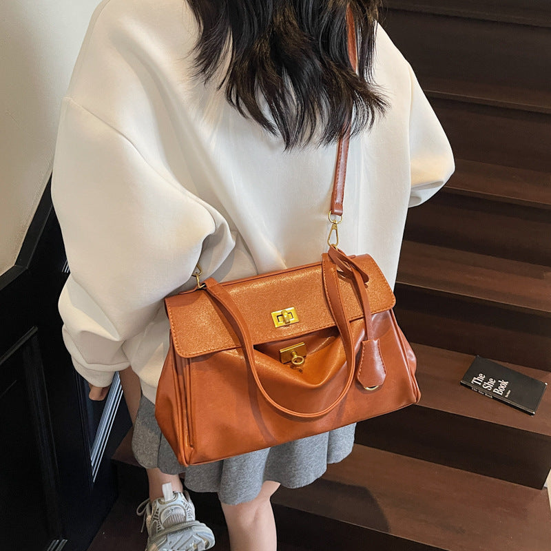 Square retro tote bag worn crossbody hands free