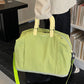 Expandable Oxford travel duffel bag shown from the front with the crossbody strap