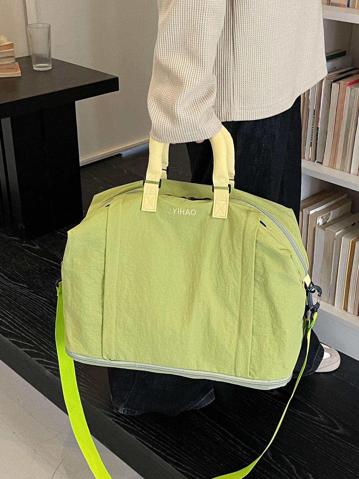 Expandable Oxford travel duffel bag shown from the front with the crossbody strap