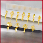 Gold-tone jewelry finding laid out ready as a small gift