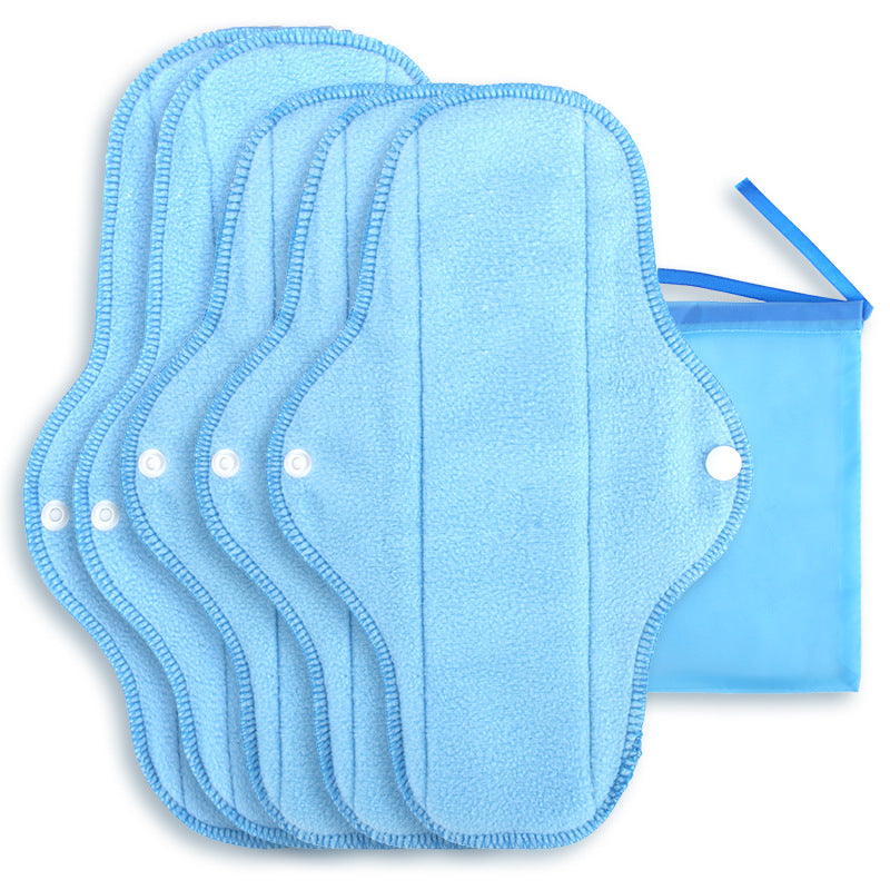 Stack of reusable cloth menstrual pads with snap wings folded closed
