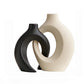 Set of two curved ceramic vases with narrow necks for slim arrangements