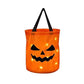Orange LED pumpkin party bag with a grinning carved face lit from inside and a black handle