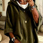 Faintly lustrous hooded top styled over jeans with the hood down
