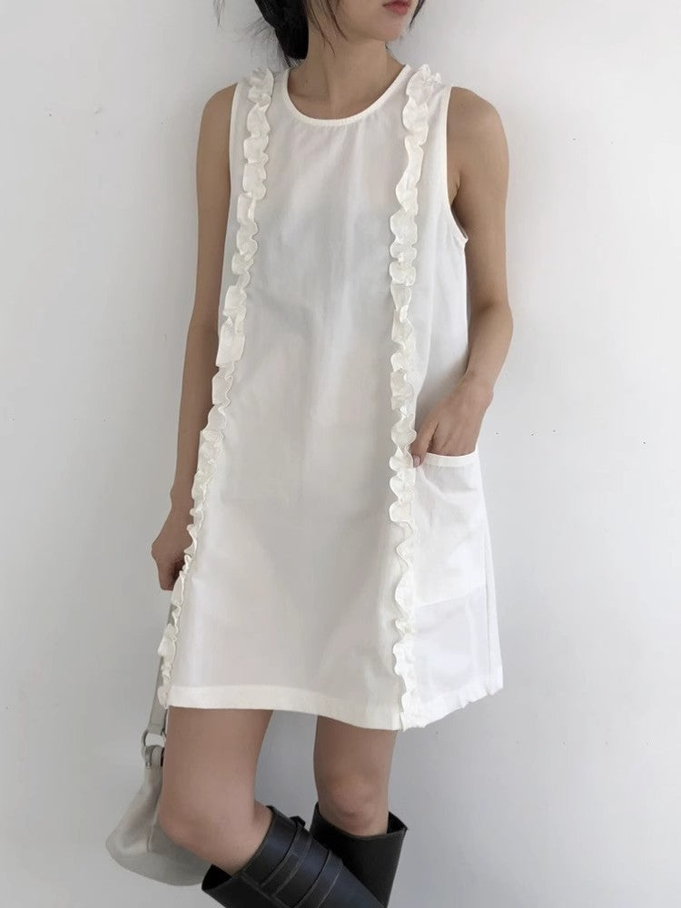 White ruffle trim sleeveless A-line dress with a front patch pocket, styled with boots