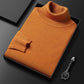 Men's slim-fit turtleneck sweater shown with the roll neck folded