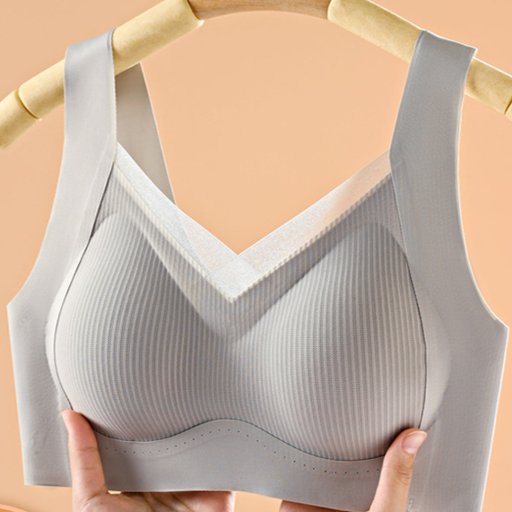 Seamless wireless vest bra side view showing smoothing side wing and wide strap