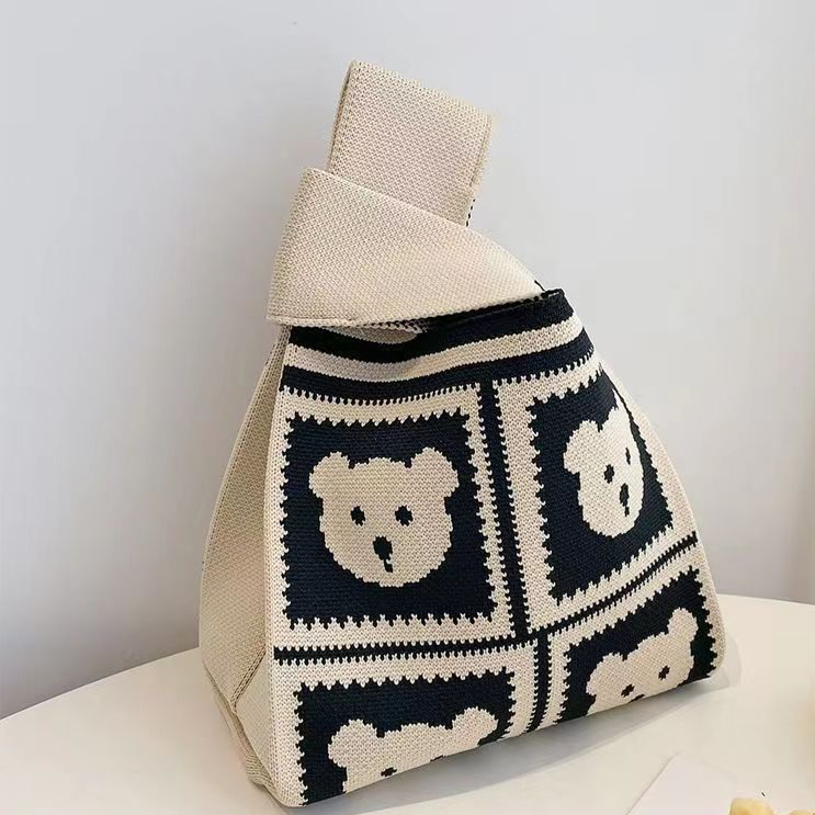Small knitted handbag with a stretchy body and a wide open top mouth