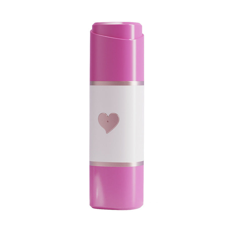 Rose red and white mini electric shaver photographed closed on a plain white background