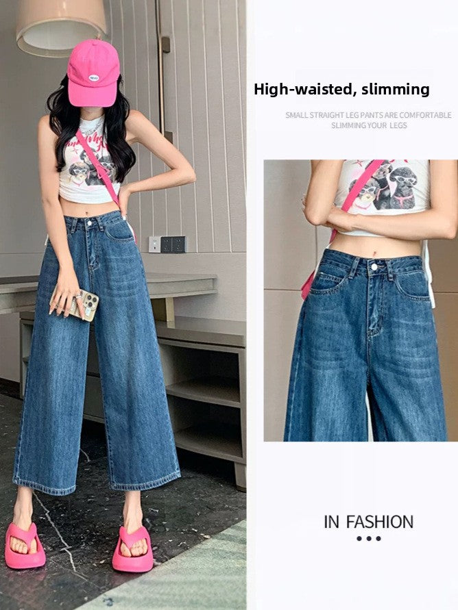 Retro blue wide-leg cropped jeans worn with a white tank and pink cap