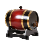 Wine red wooden barrel drink dispenser with gold hoops and a wooden tap on a black stand