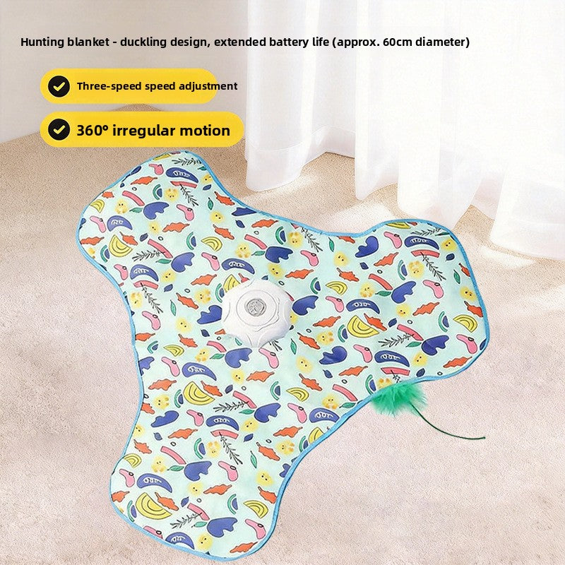 Duckling print three lobed cat teaser mat on carpet with motor puck and green feather wand at the edge
