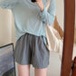 Lightweight synthetic ice silk shorts on a woman with an airy wide leg and soft drape