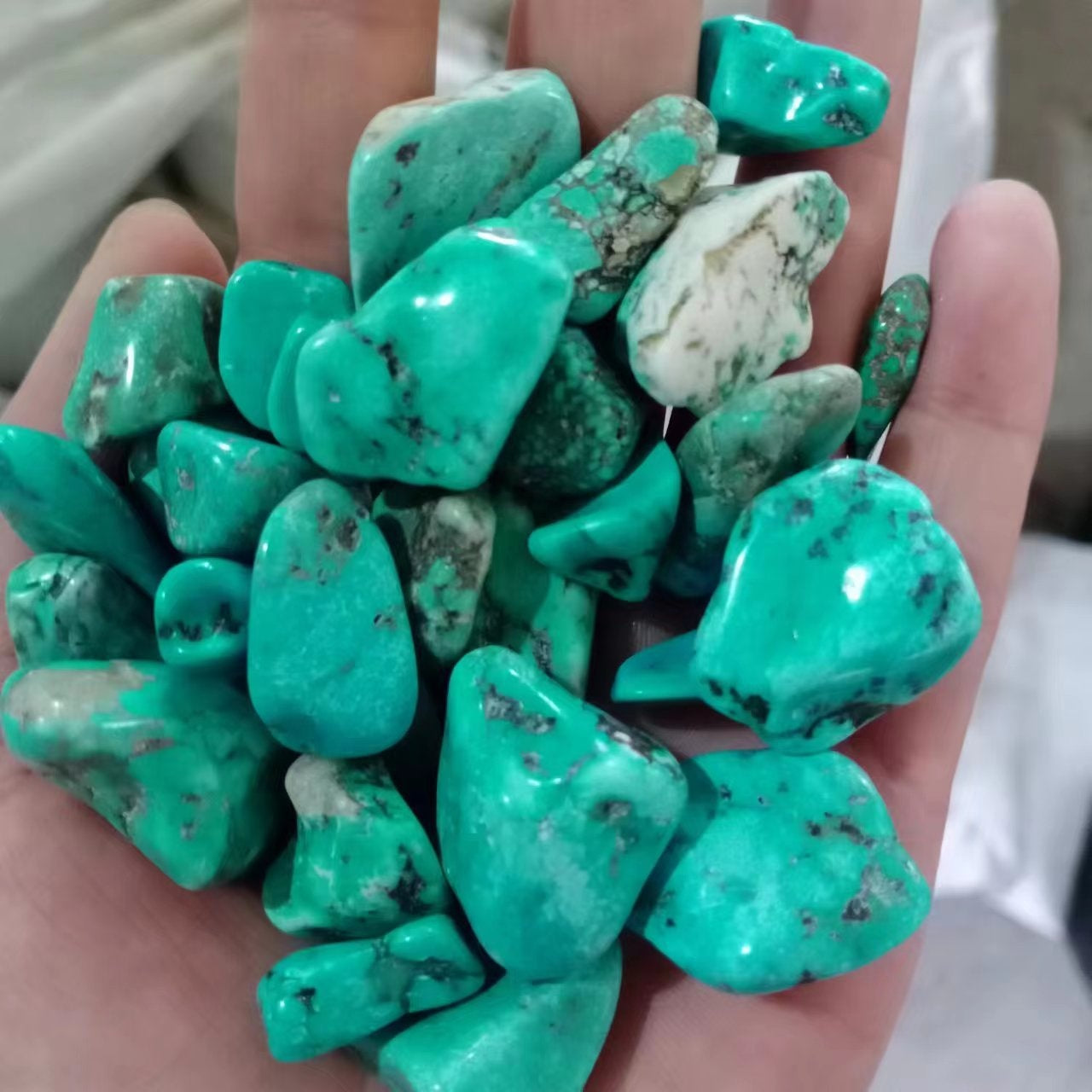 Larger tumbled agate stones in mixed colours for landscaping accents