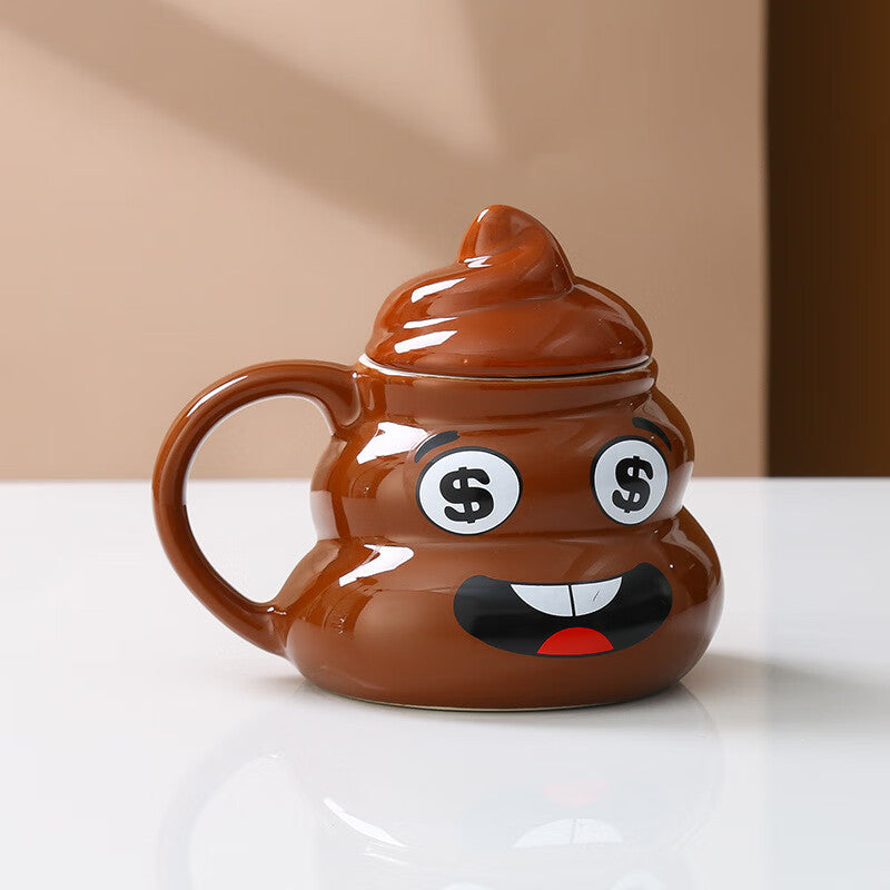 Brown poop emoji ceramic mug with a naughty grinning face and a rounded handle on a counter