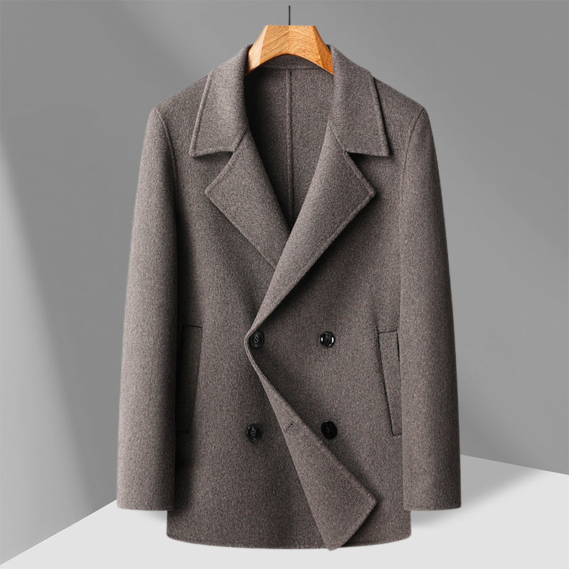 Camel toned double faced wool overcoat shown flat on a hanger, double breasted front view