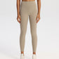 High-waisted compressive yoga leggings for women, full-length studio shot on a model