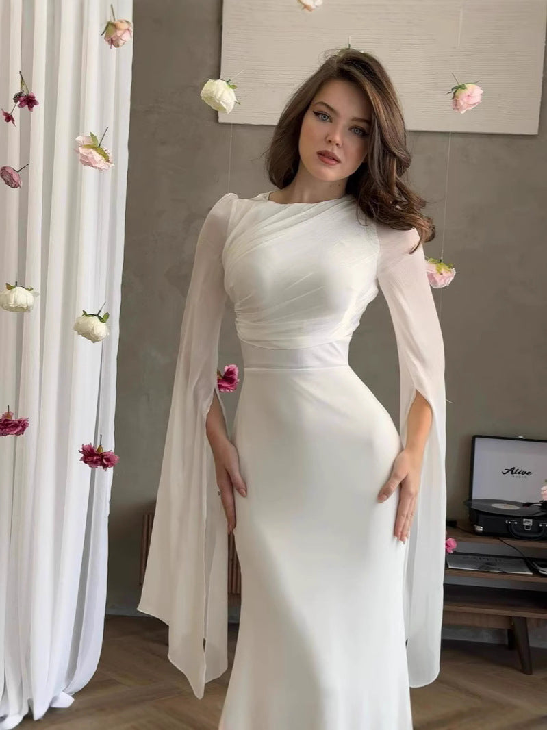 Side angle of the slim-fit dress showing how the line follows the silhouette