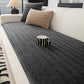 Quilted lambswool sofa cover with a wave stitch face on a sofa