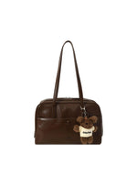 Retro Pillow Shoulder Bag in brown worn over the shoulder for a casual everyday look
