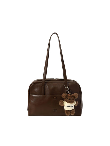 Retro Pillow Shoulder Bag in brown worn over the shoulder for a casual everyday look