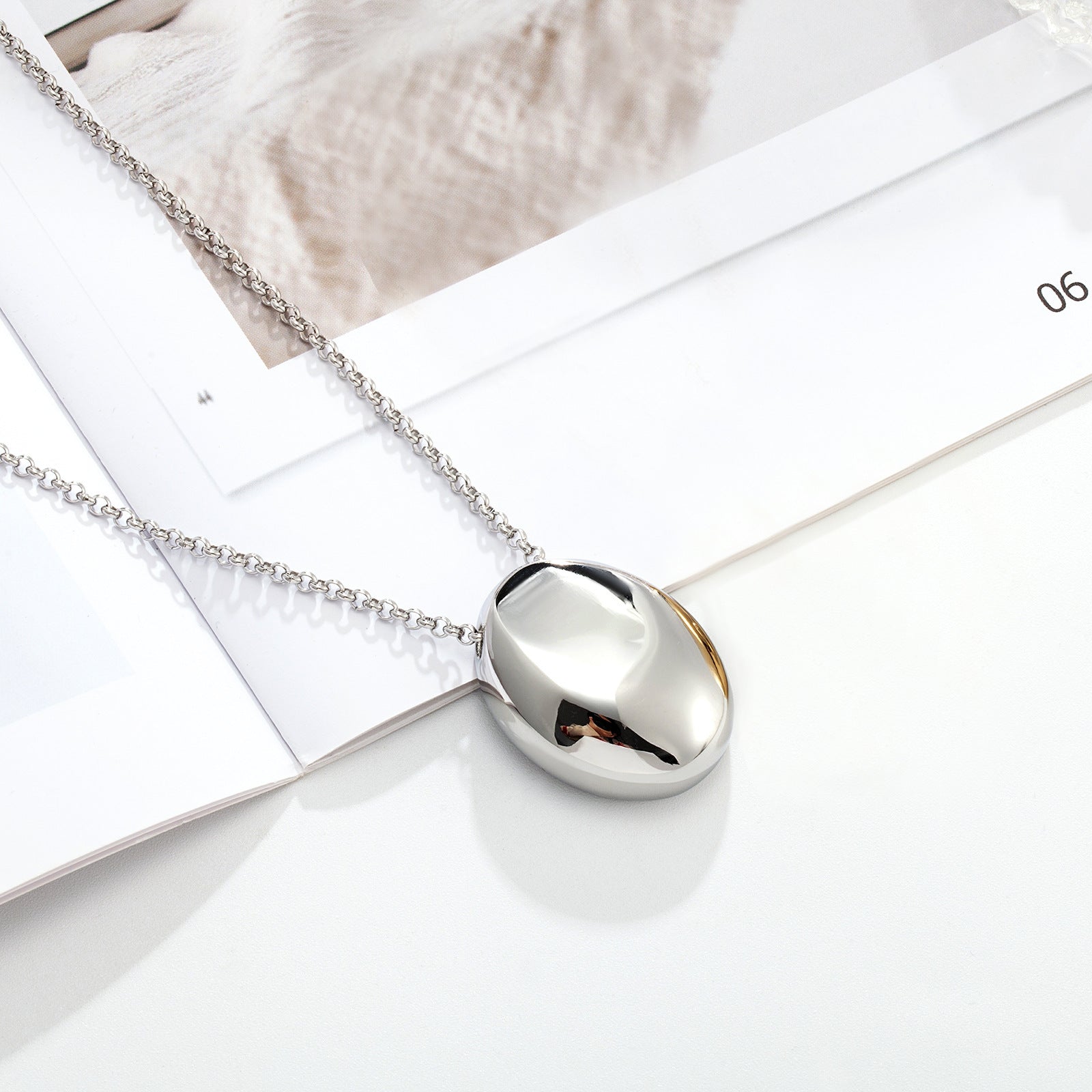 Drop pendant necklace side angle showing chain and clasp
