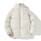 Men's padded puffer jacket worn loose over a hoodie on a model