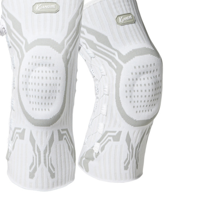 Knit compression knee brace with silicone patella pad worn during a training session