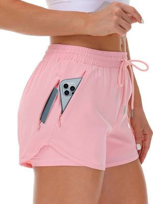 A pink side view of womens running shorts showing the phone pocket holding a phone