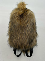 Plush fur travel backpack front view showing soft shell and zip