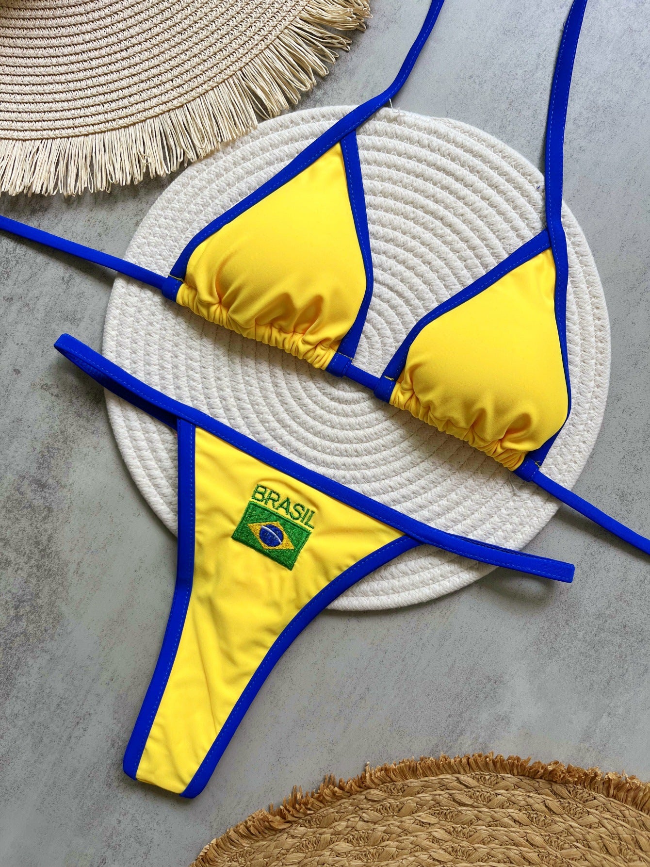 Yellow Brasil halter bikini top and thong brief flat lay view