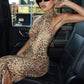 Side view of the fitted leopard print maxi dress, warm brown and tan print