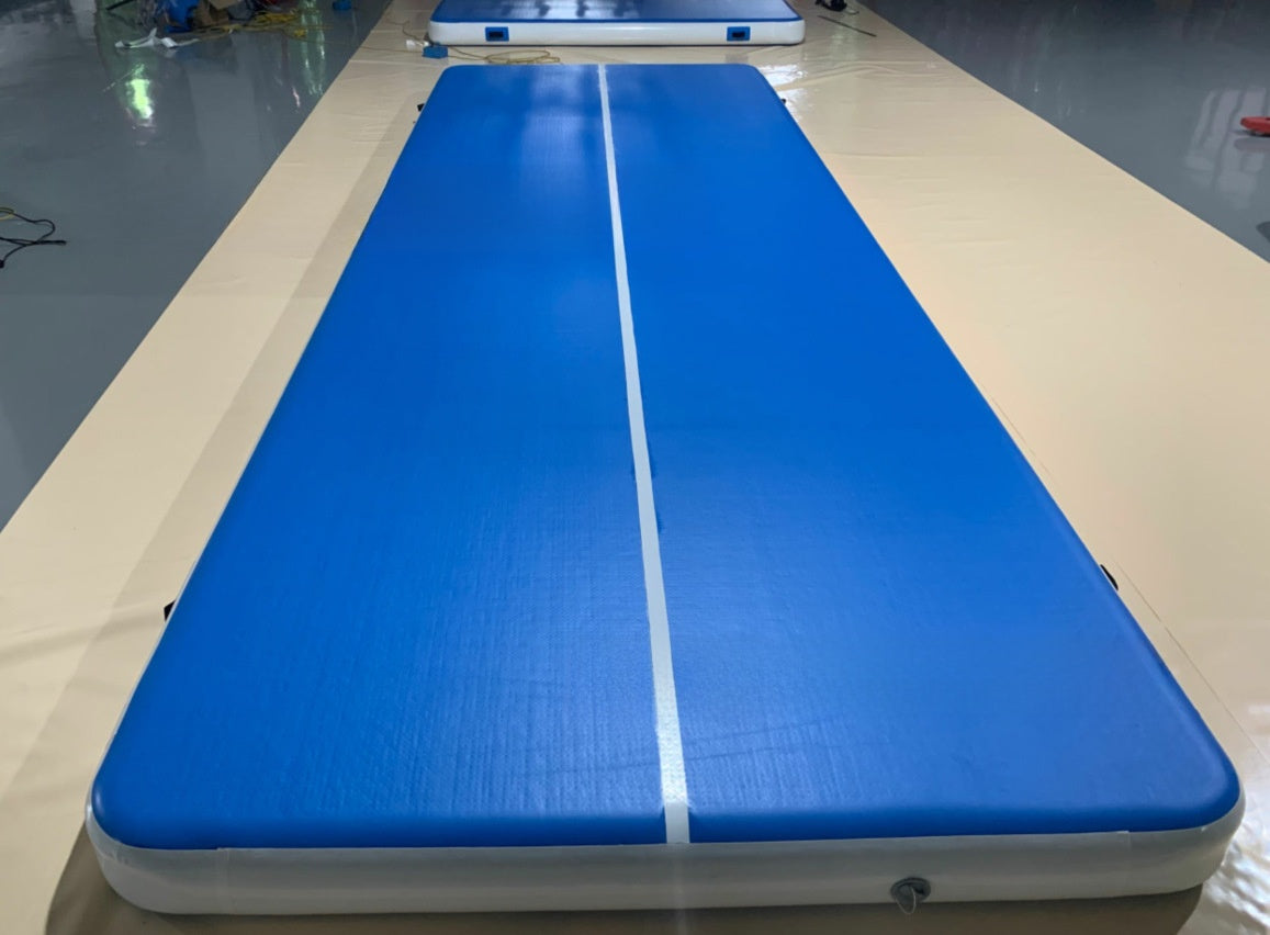 Blue inflatable air track mat with a white center stripe laid flat on a floor, 5 x 2 x 0.2 m option photo