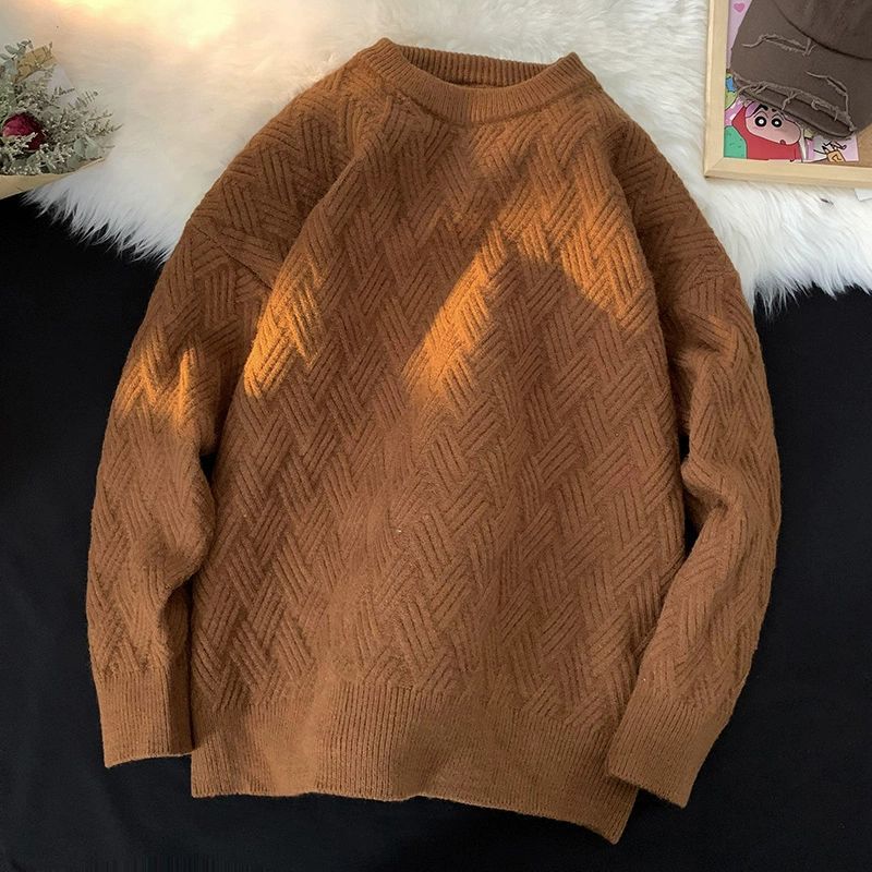 Brown heavyweight round neck knit pullover with a raised basketweave jacquard texture
