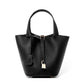 Leather bucket tote bag styled alongside a daily outfit
