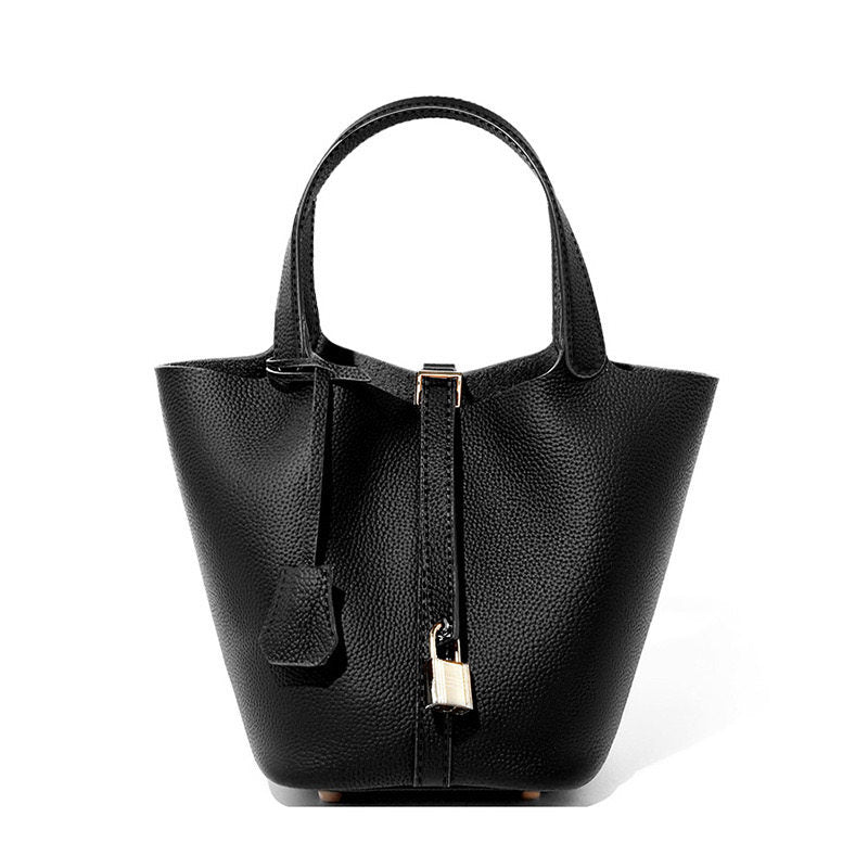 Leather bucket tote bag styled alongside a daily outfit